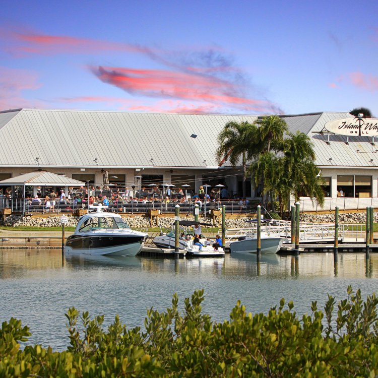 An overview of the Island Way Grill exterior during sunset
