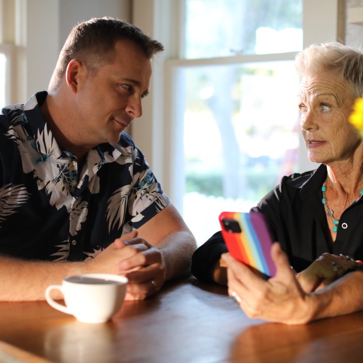 Two actors looking at their phone