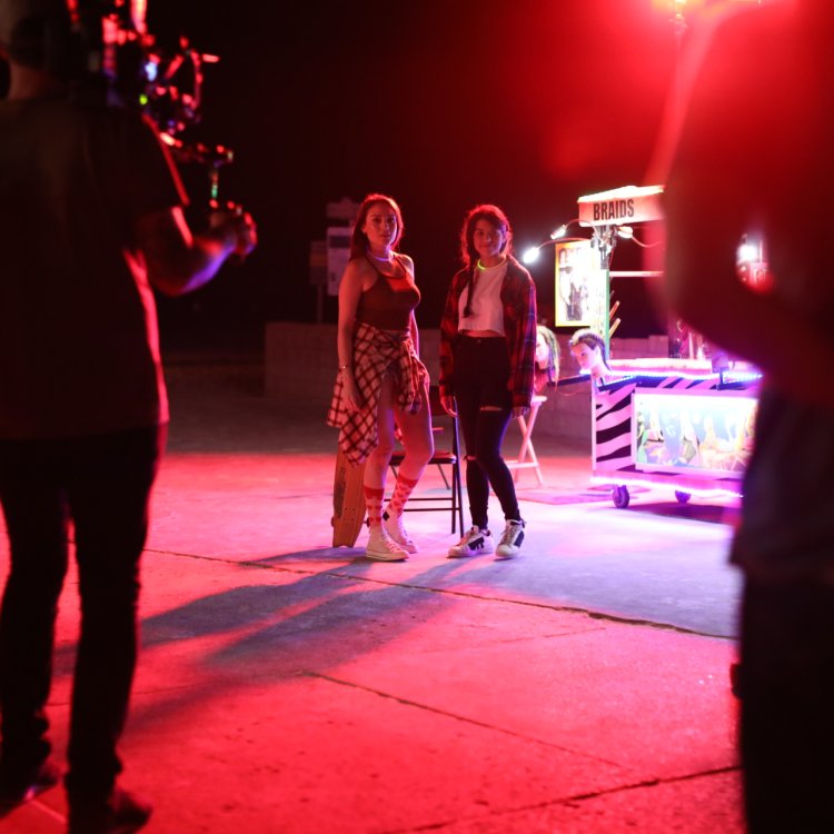 two actors preparing for a night shoot
