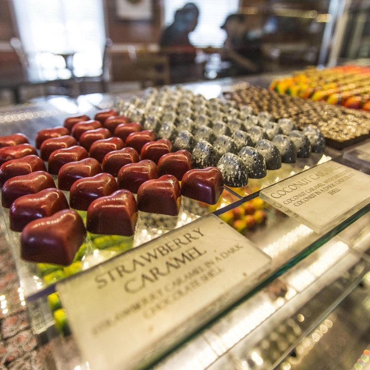 several types of fancy chocolates in a glass case