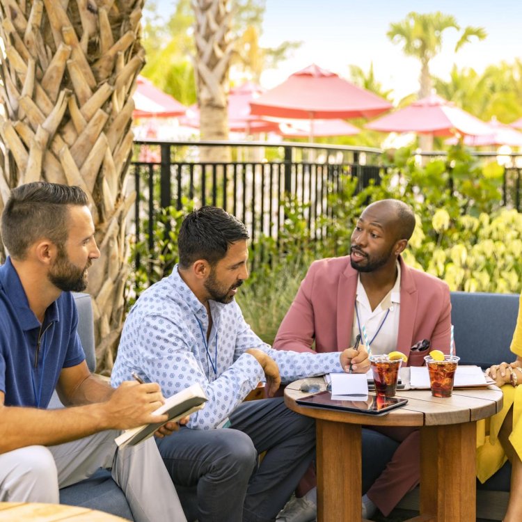 People around a table talking