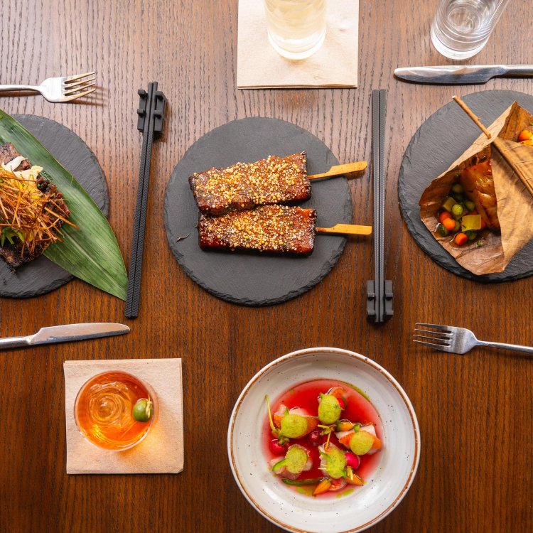 Plates of various Asian fusion dishes