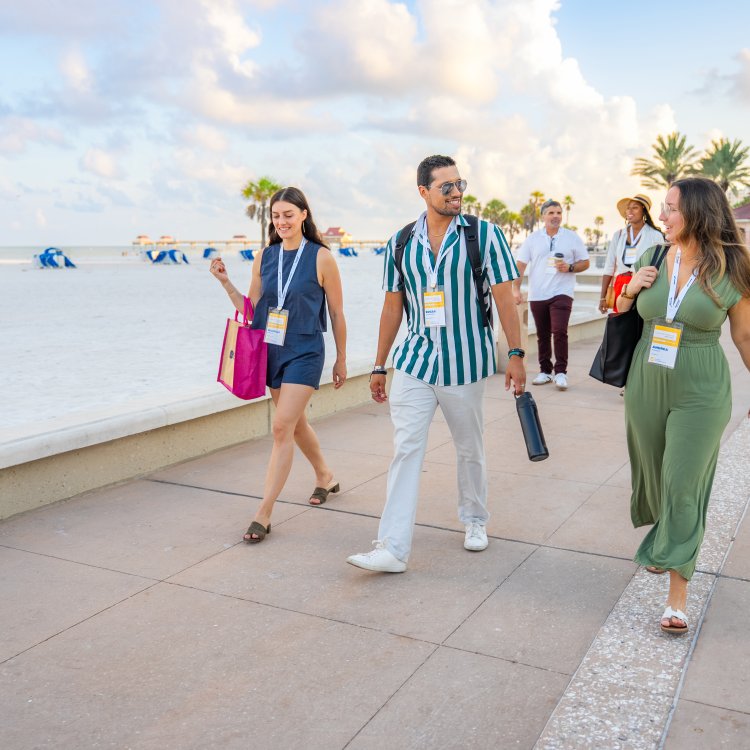 Meeting attendees walk outside the Opal Sol resort on Clearwater Beach