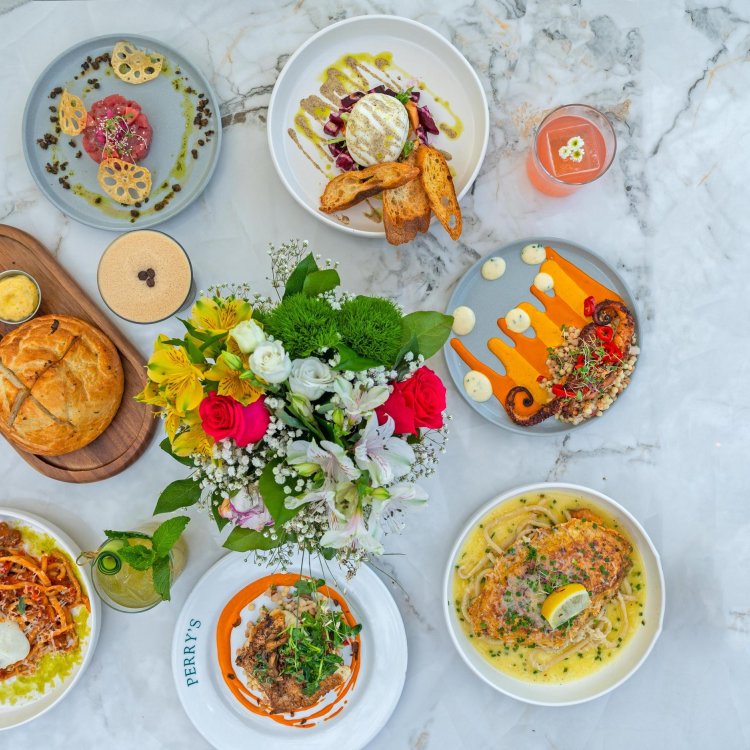 a marble table with many colorful dishes at Perry's Porch at the St. Pete Pier