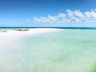 Anclote Key white sand and emerald-green water beach.