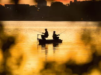 Two man fishing at sunset