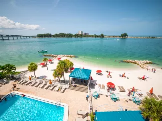An overview of pool and beachfront of Dolphin Beach Club.