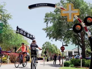 Bikers at Pinellas Trail crossing Dunedin's Main St.