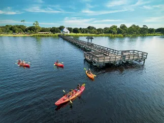 A group of people kayaking near Oldsmar pier at R.E. Olds Park.