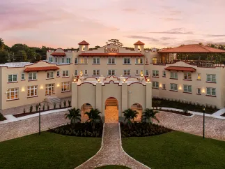 An aerial view of a large hotel at sunrise