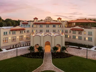 An aerial view of a large hotel at sunrise