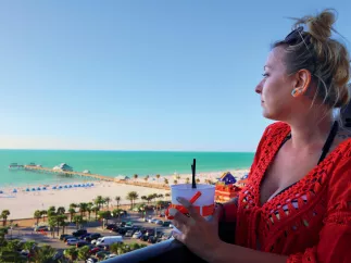 A woman looks out to the beach at Jimmy's Crow's Nest on Clearwater Beach