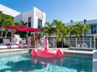 girls walking by the pool