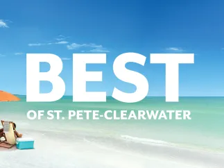 a beautiful beach with white sand and turquoise water and a couple sitting under an umbrella; the image has the words "Best of St. Pete-Clearwater" on top of it