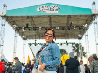 girl in front of concert stage