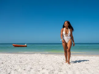 A woman walking on the beach
