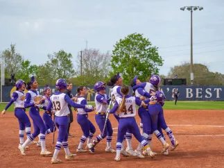 softball players celebrating 