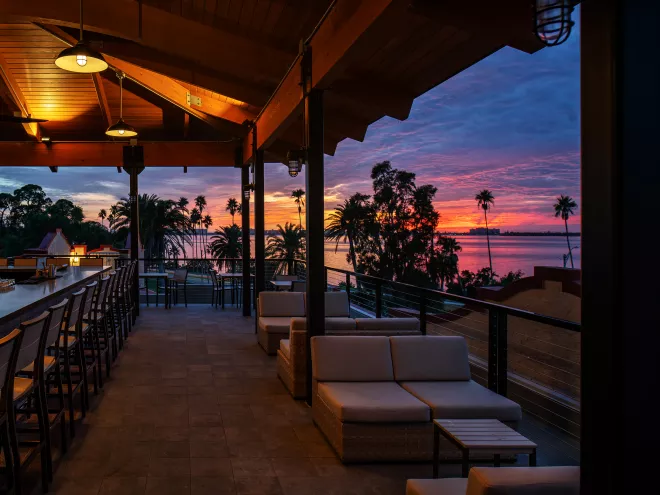 A colorful sunset seen from the rooftop bar at Fenway Hotel.
