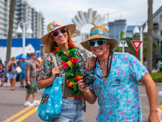 two people dressed up in costumes as tourists attending the Halloween on Central event in St. Pete