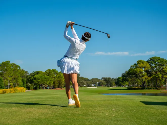 a player makes a long drive at The ANNIKA LPGA tournament