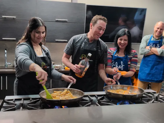 Chef teaching a cooking class to participants.