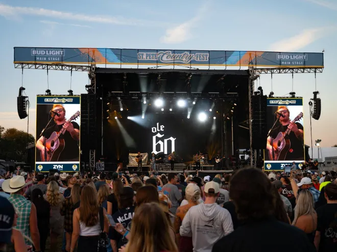 Ole 60 performs on the main stage as a large crowd watches at St. Pete Country Fest in Vinoy Park.