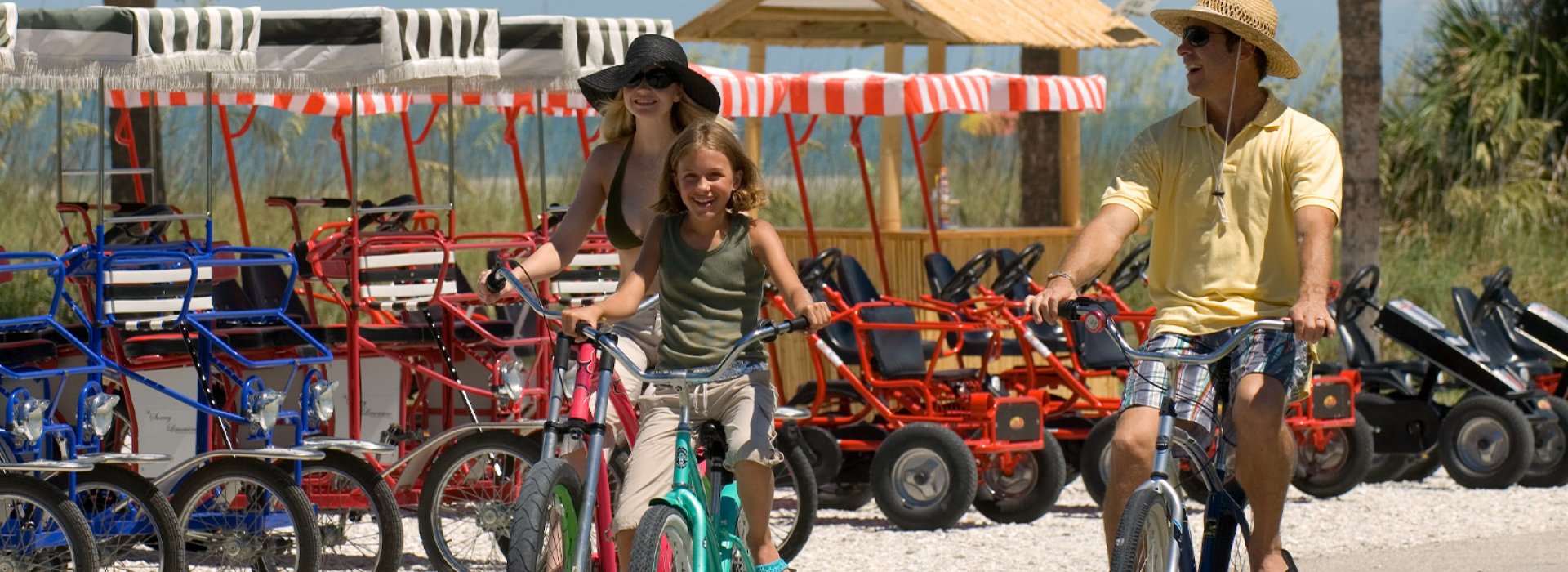 Family riding bicycles in Fort de Soto park.