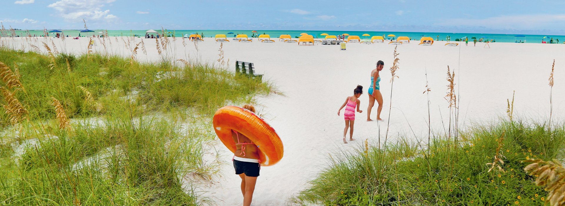 Family walking to St. Pete Beach.