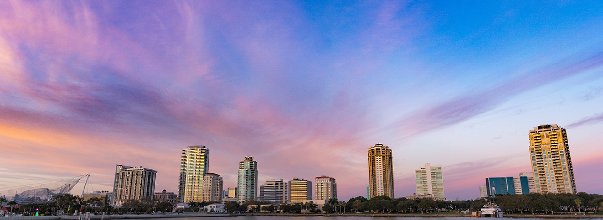 Blue and purple sunrise sky of St. Pete downtown skyline.