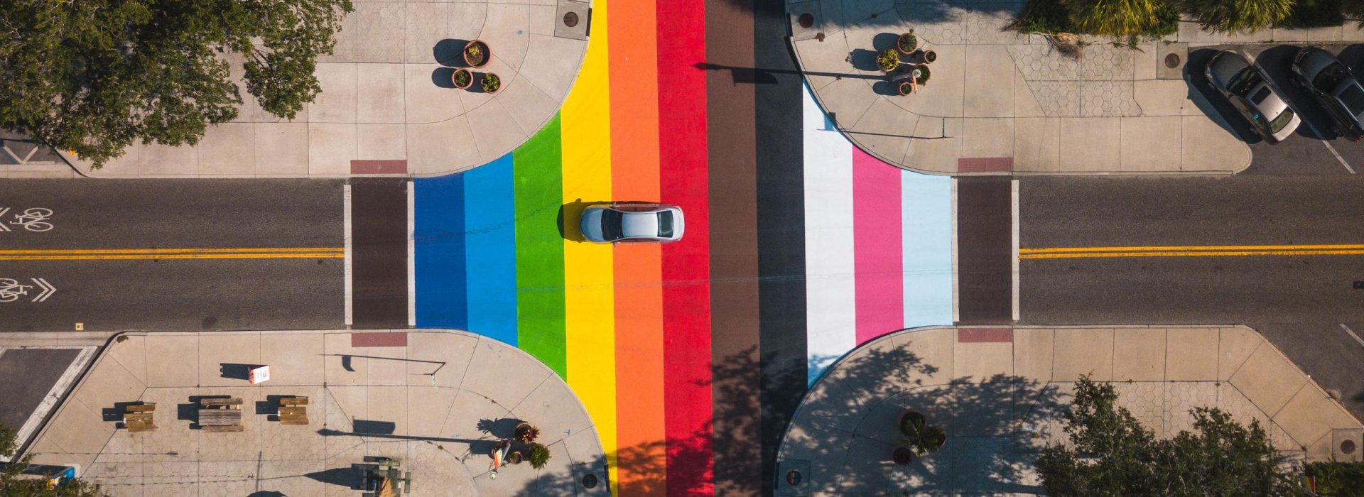 An aerial view of a colorful LGBTQ+ street mural at an intersection of the Grand Central District of Saint Pete.