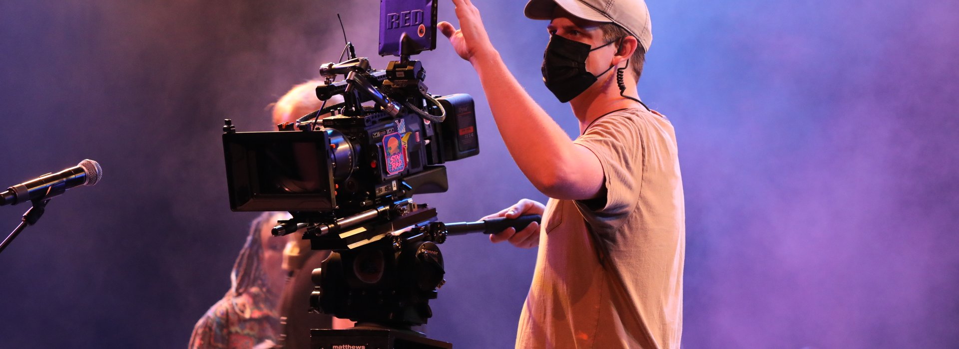 Man working a camera during a show