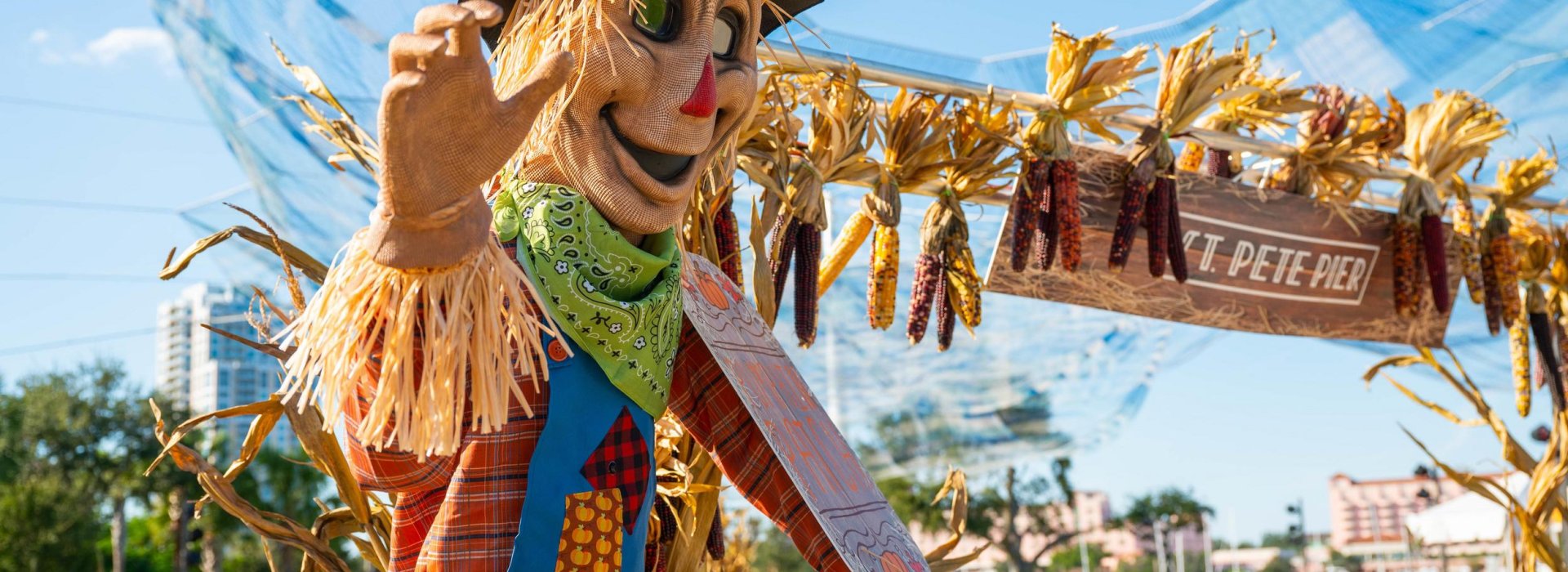 Scarecrow waving during St. Pete Pier pumpkin patch