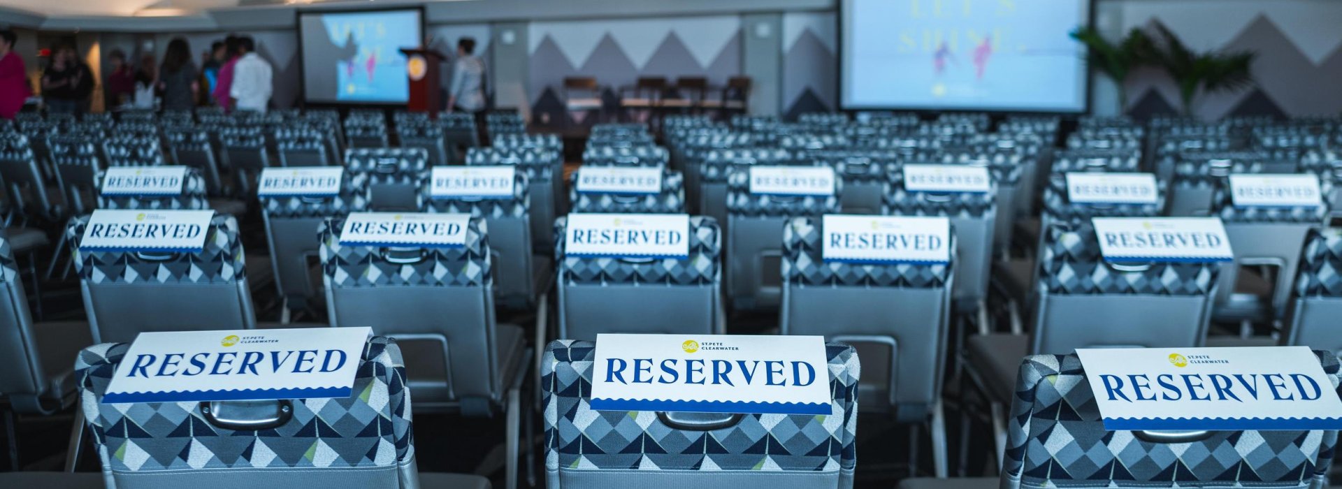 chairs with reserved signs on them