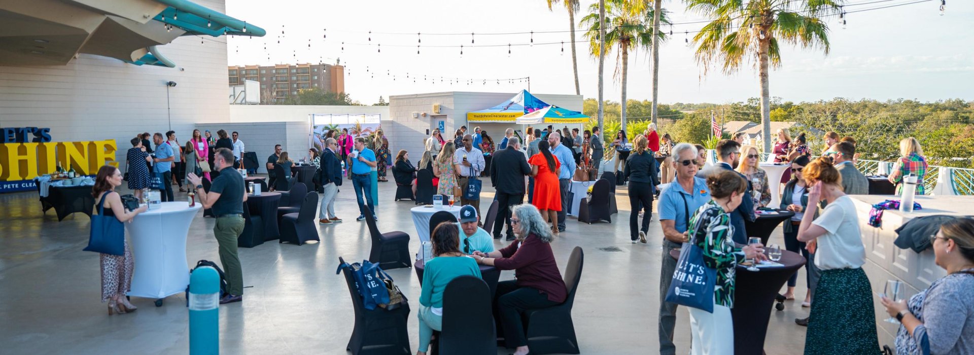 Groups of individuals gathering and meeting in an outdoor space