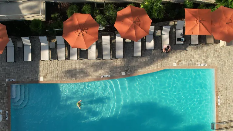 A woman in a pool at the Fenway Hotel