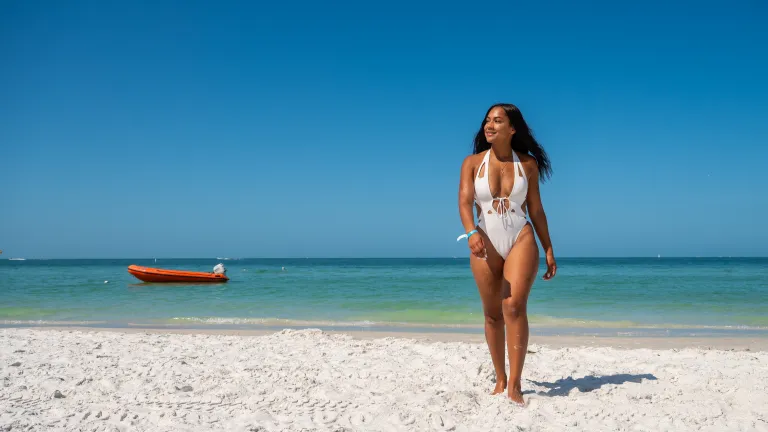 A woman walking on the beach