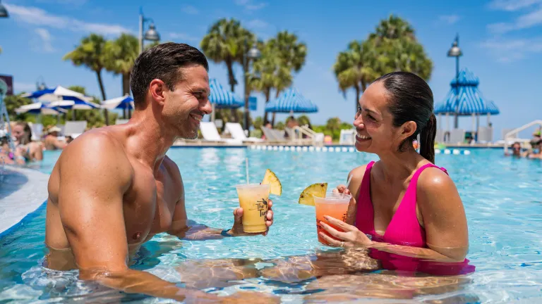 A Couple sits in a pool at the Clearwater Beach Sheraton Resort