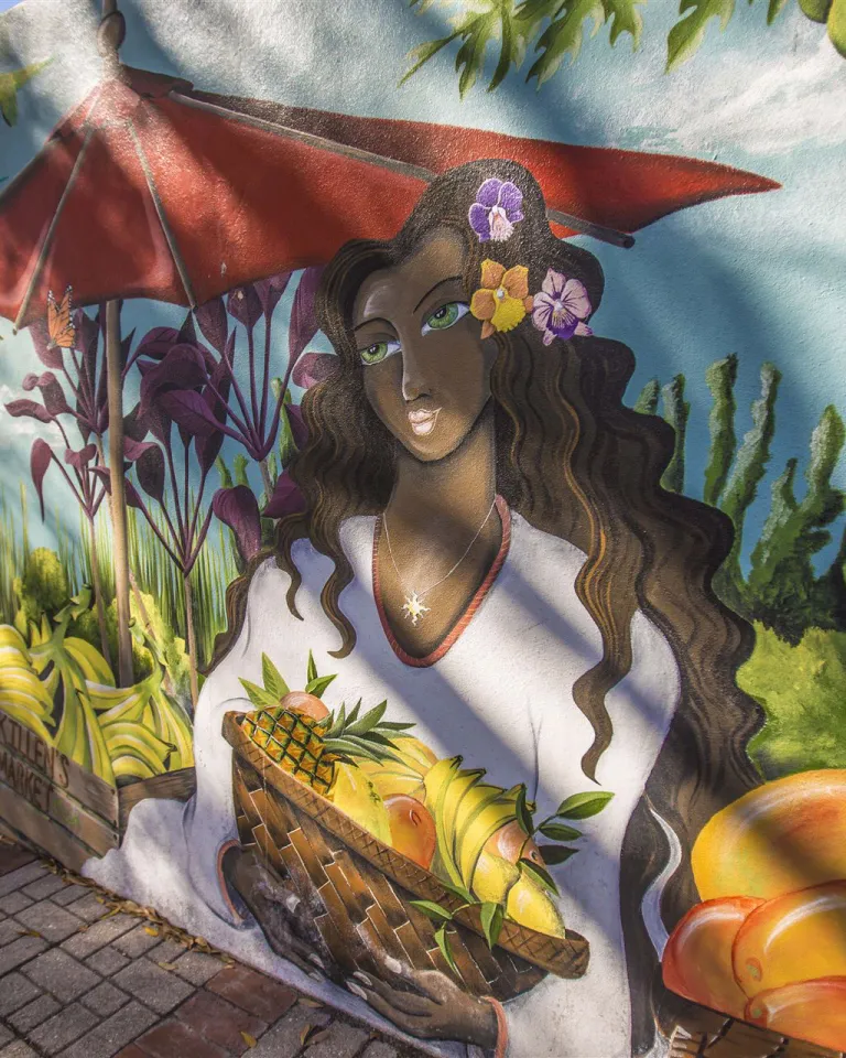 A mural of a lady holding a fruit basket from the Florida Botanical Gardens