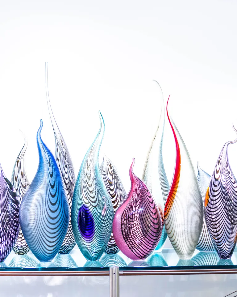 Colorful glass sculpture looking like fire flames at Imagine Museum