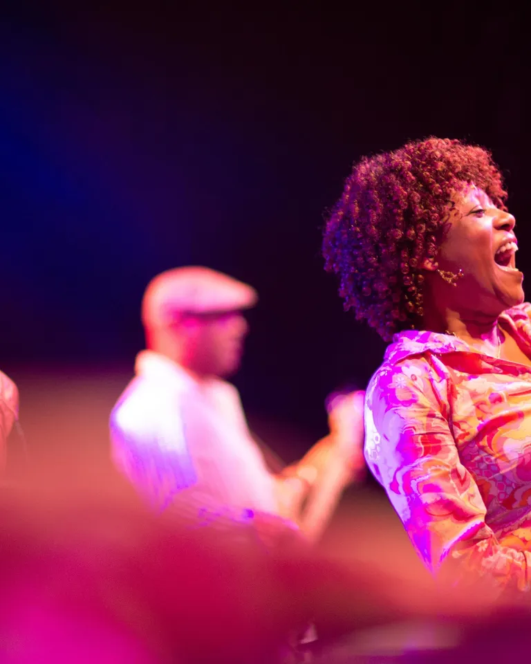 An African-American woman singing at Jannus Live in St. Pete.