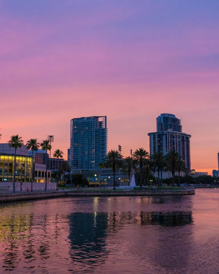 A vibrant pink and purple sunset over the Saint Pete Waterfront District.