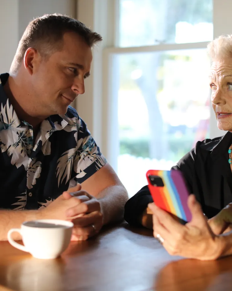 Two actors looking at their phone