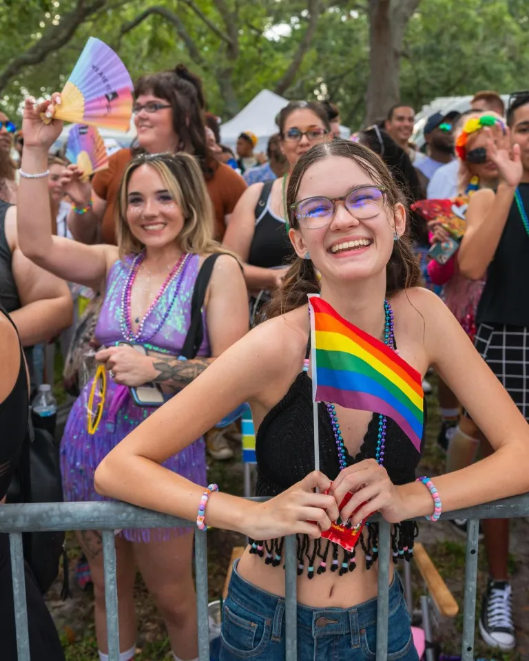smiling people along the parade route at the St. Pete Pride Parade
