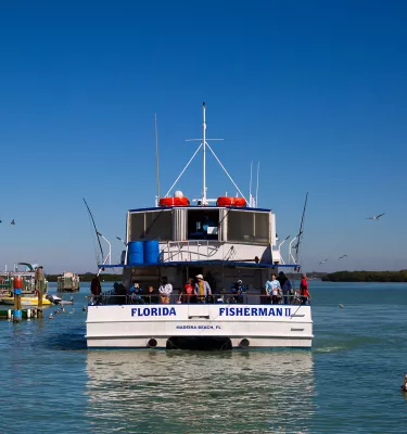 Florida Fisherman boat leaving John's Pass Marina in Madeira Beach