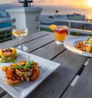 Rooftop dining during sunset at The Dewey