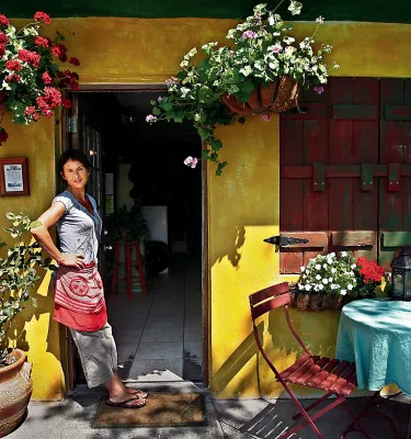 A waitress stands in the doorway of Pia's Trattoria in Gulfport