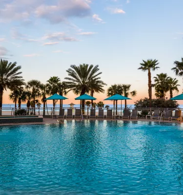 Wyndham Grand Clearwater Beach pool during sunset