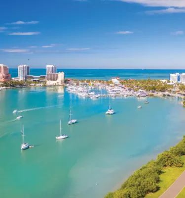 Clearwater Marina and Memorial Causeway overview showing sailboats, green waters and bright blue sky.