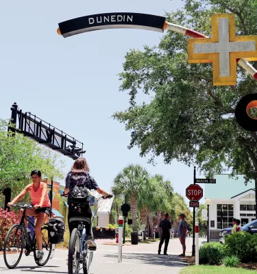 Bikers at Pinellas Trail crossing Dunedin's Main St.
