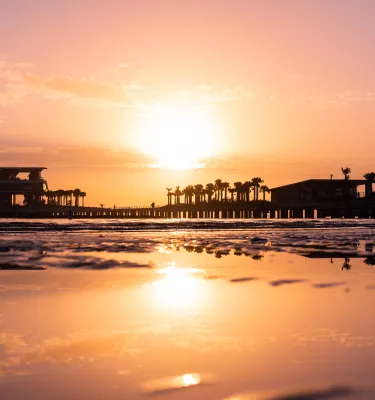 A pink and orange sunrise at St. Pete Pier